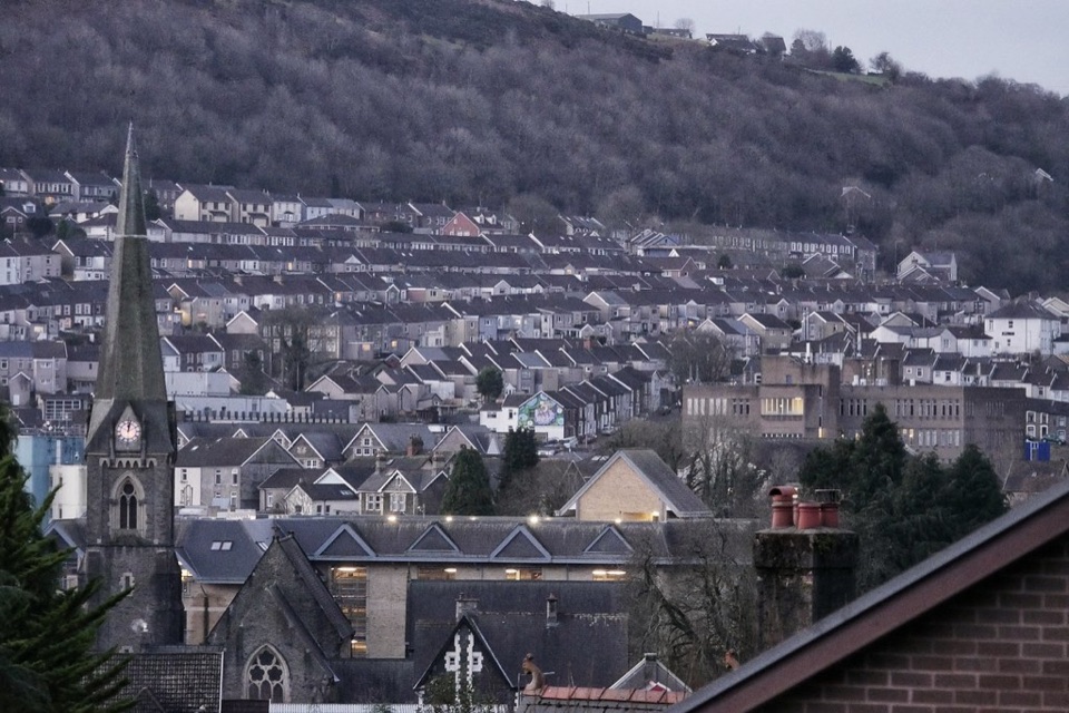 Rows of terraced houses climbing a valley hillside in south Wales